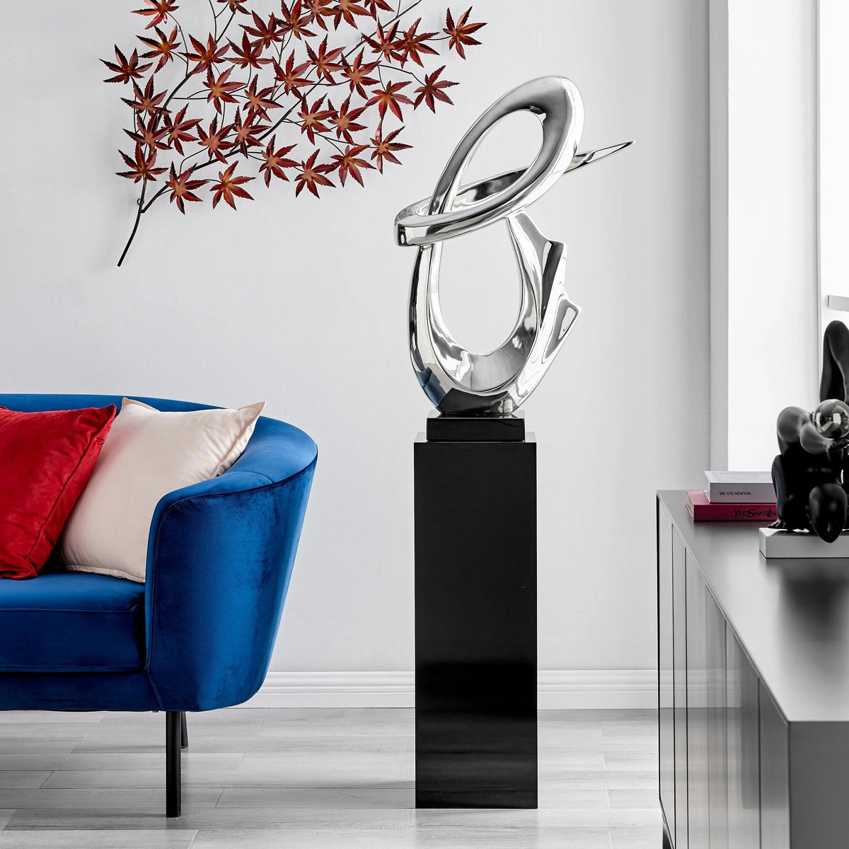 CHROME FLUID ABSTRACT FLOOR SCULPTURE WITH BLACK STAND, 59" TALL